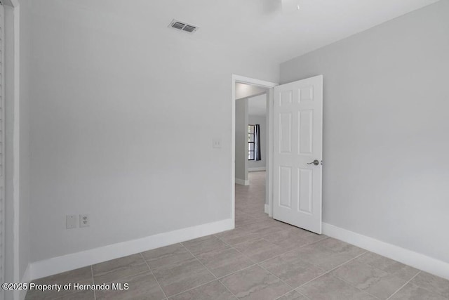 11080 Marquette St, Spring Hill, FL 34609 - empty room featuring visible vents, baseboards, and light tile patterned flooring