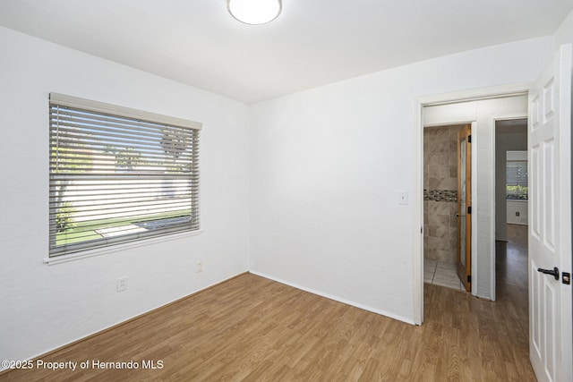 spare room with light wood-style flooring