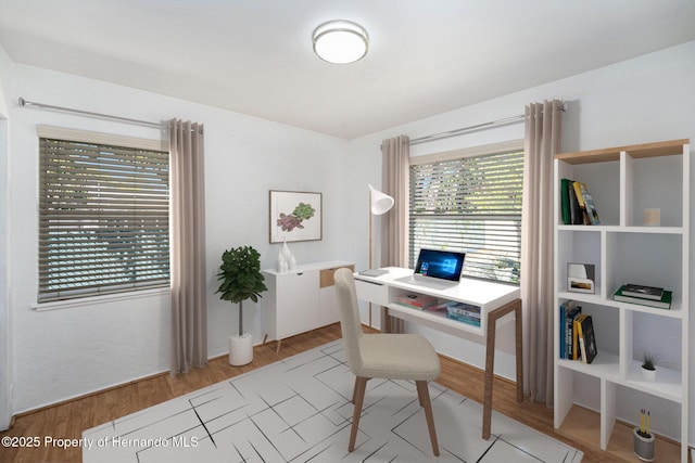 office with light wood-style floors