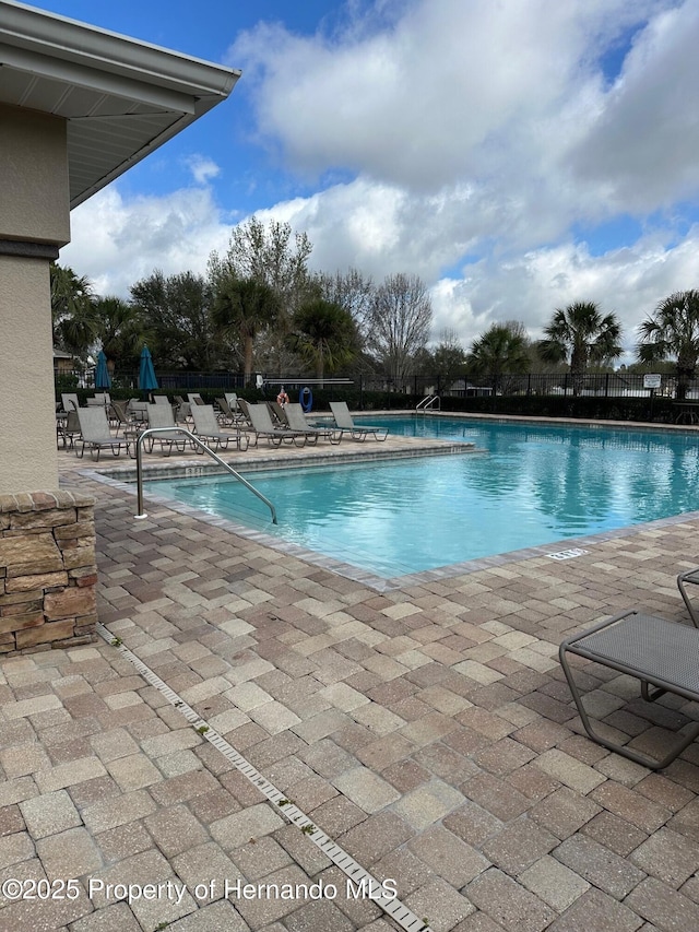 8480 Southern Charm Cir, Brooksville, FL 34613 - pool featuring a patio and fence