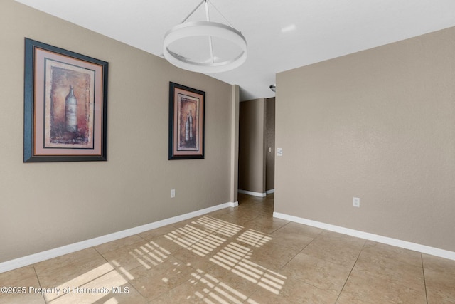 1018 Stratton Ave, Spring Hill, FL 34609 - empty room with tile patterned flooring and baseboards