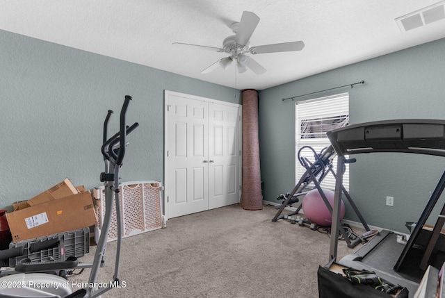 1018 Stratton Ave, Spring Hill, FL 34609 - exercise area with a textured ceiling, visible vents, carpet, a ceiling fan, and a textured wall