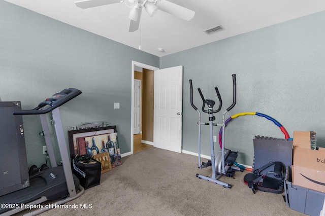 1018 Stratton Ave, Spring Hill, FL 34609 - exercise room with baseboards, visible vents, carpet, and a ceiling fan