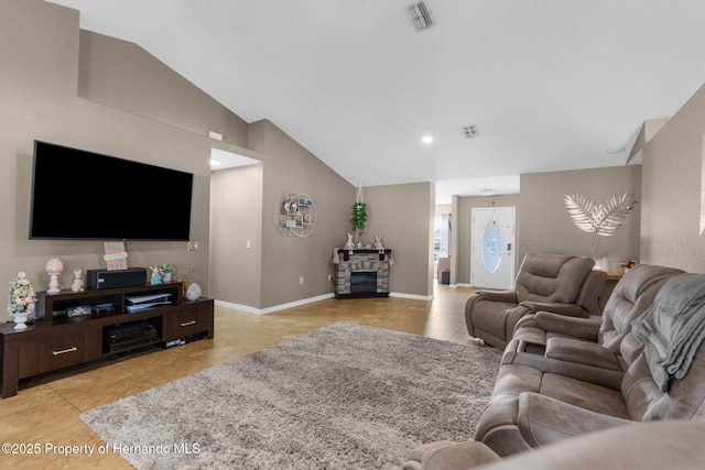1018 Stratton Ave, Spring Hill, FL 34609 - living area with light tile patterned flooring, baseboards, visible vents, and vaulted ceiling