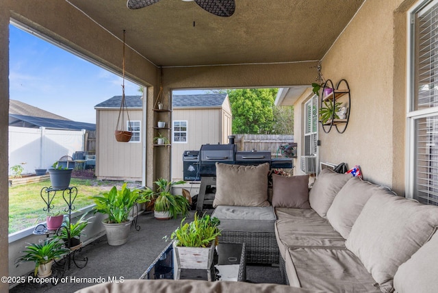 1018 Stratton Ave, Spring Hill, FL 34609 - view of patio with a grill, an outbuilding, fence, a storage shed, and outdoor lounge area