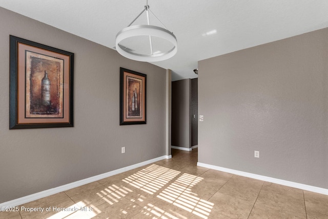 1018 Stratton Ave, Spring Hill, FL 34609 - empty room with light tile patterned floors and baseboards