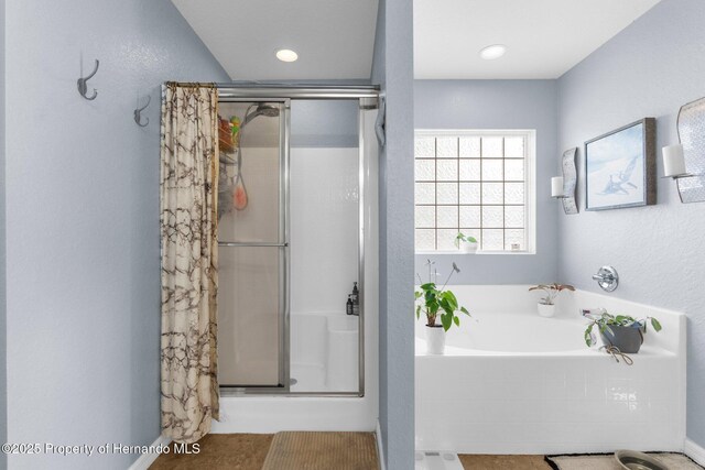 1018 Stratton Ave, Spring Hill, FL 34609 - bathroom with a stall shower and a bath