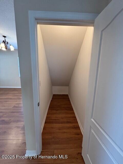200 Fairmont Dr, Spring Hill, FL 34609 - interior space with a notable chandelier, baseboards, and wood finished floors
