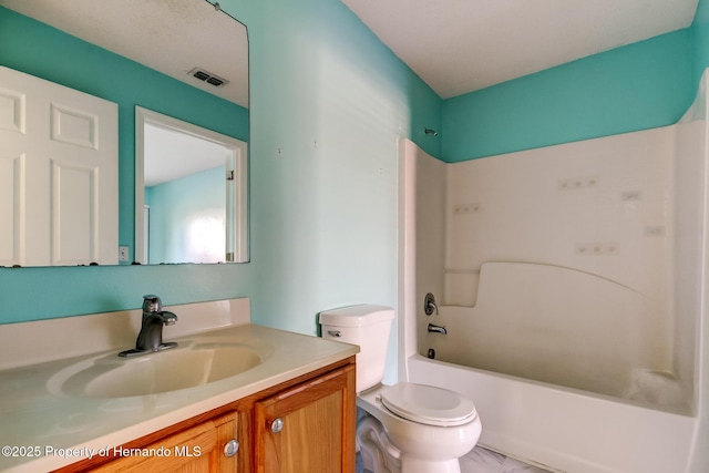 full bath featuring visible vents, toilet, vanity, and shower / bathtub combination