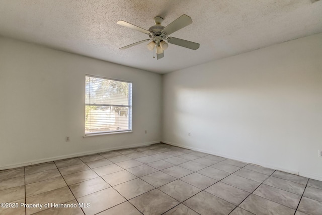 unfurnished room with a textured ceiling, baseboards, and ceiling fan