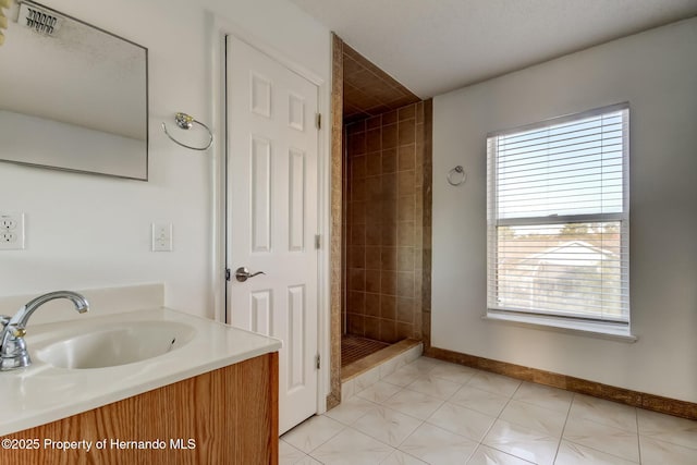full bathroom with a stall shower, baseboards, visible vents, and a healthy amount of sunlight