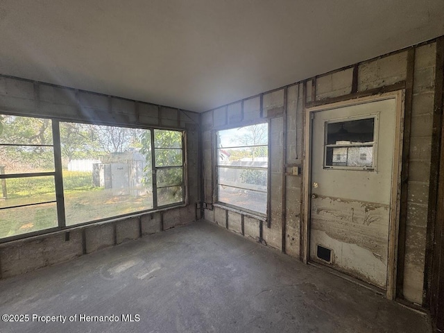unfurnished sunroom featuring visible vents