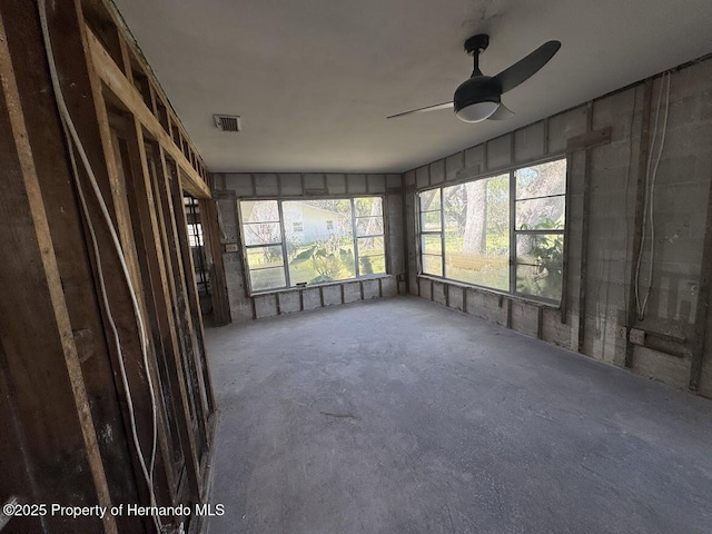 interior space featuring concrete floors and visible vents