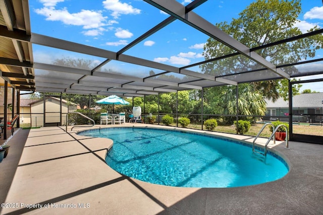 11256 Holbrook St, Spring Hill, FL 34609 - pool featuring a shed, a lanai, an outbuilding, and a patio