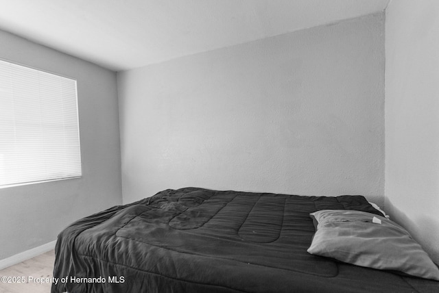 406 Zoller St, Brooksville, FL 34601 - bedroom featuring baseboards and wood finished floors