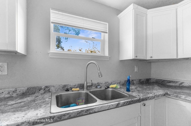 406 Zoller St, Brooksville, FL 34601 - kitchen featuring white cabinets and a sink