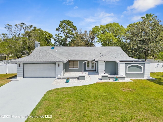 1156 Battersea Ave, Spring Hill, FL 34609 - single story home featuring a front yard, roof with shingles, concrete driveway, fence, and a garage