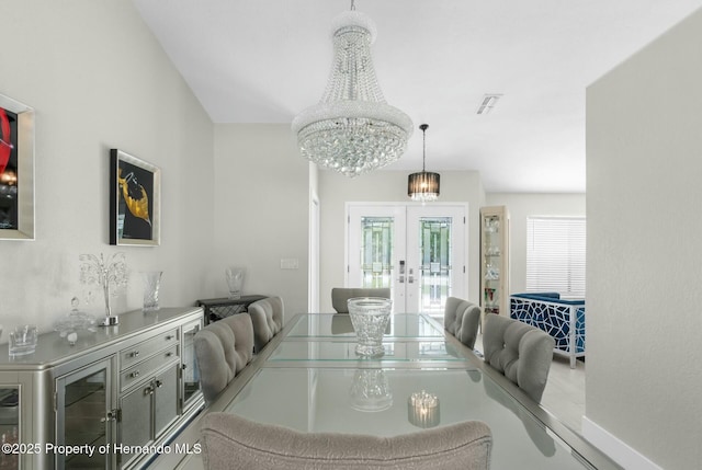 1156 Battersea Ave, Spring Hill, FL 34609 - dining room featuring french doors, a notable chandelier, and visible vents