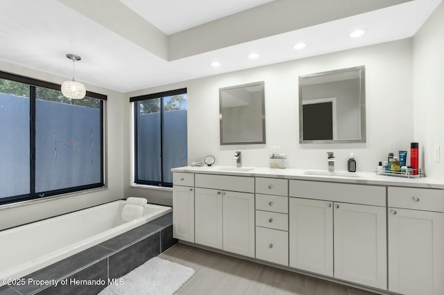 1156 Battersea Ave, Spring Hill, FL 34609 - bathroom featuring double vanity, a sink, and plenty of natural light