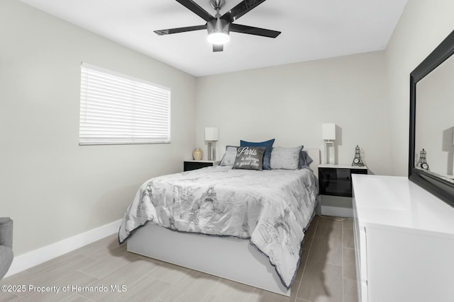 1156 Battersea Ave, Spring Hill, FL 34609 - bedroom with baseboards, ceiling fan, and wood finish floors