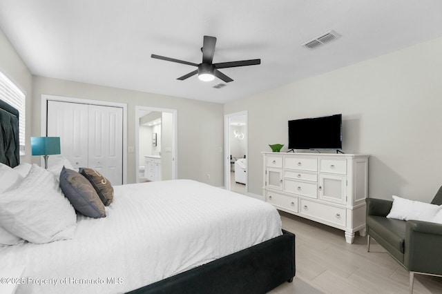 1156 Battersea Ave, Spring Hill, FL 34609 - bedroom with a closet, a ceiling fan, light wood-style flooring, ensuite bathroom, and visible vents