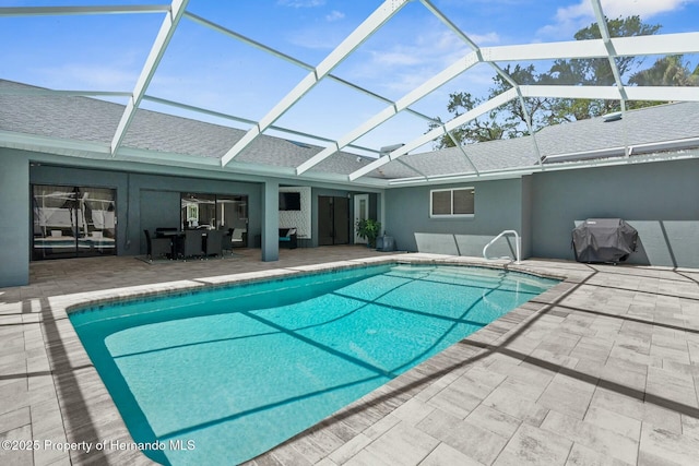 1156 Battersea Ave, Spring Hill, FL 34609 - outdoor pool featuring glass enclosure and a patio