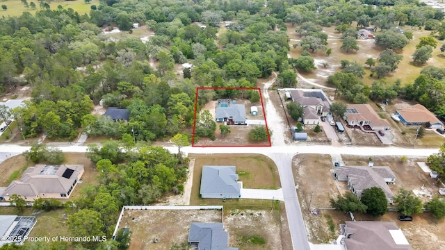 aerial view of residential area with property boundaries highlighted