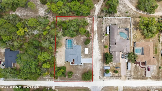aerial view of property and surrounding area with property parcel outlined