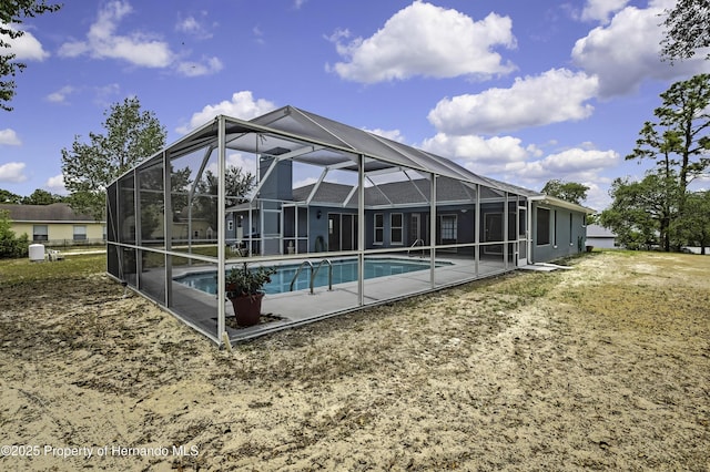 swimming pool featuring a patio area and a lanai