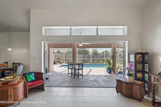 interior space featuring tile patterned floors and ceiling fan