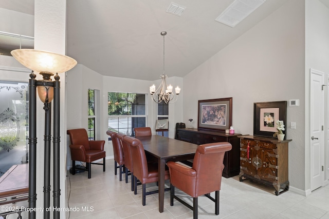 dining area featuring light tile patterned flooring, high vaulted ceiling, a chandelier, and visible vents