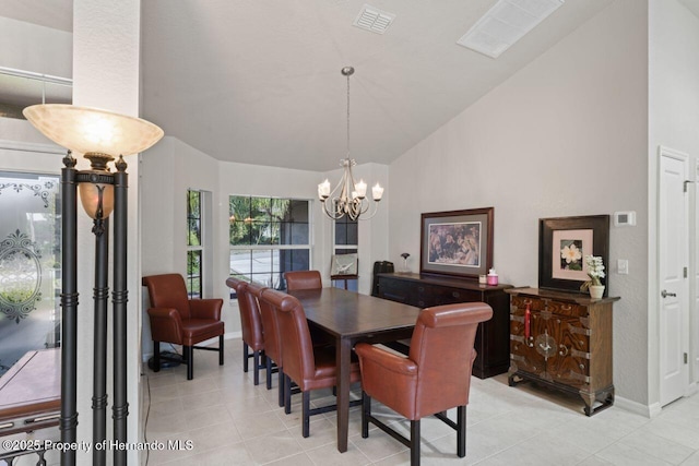 dining area featuring light tile patterned floors, a notable chandelier, and visible vents