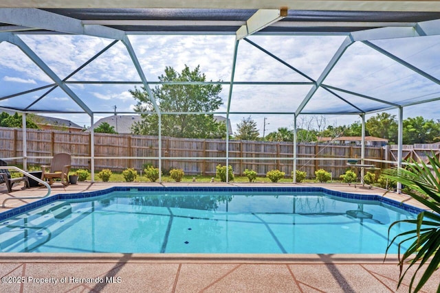 view of pool featuring a fenced backyard, a lanai, a patio area, and a fenced in pool
