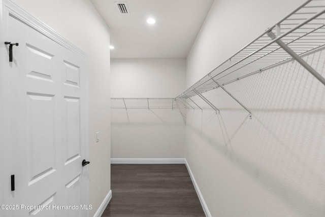 16043 Penn State Rd, Weeki Wachee, FL 34614 - spacious closet with wood finished floors
