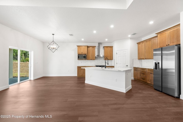16043 Penn State Rd, Weeki Wachee, FL 34614 - kitchen with appliances with stainless steel finishes, wall chimney range hood, dark wood-style floors, brown cabinetry, and recessed lighting