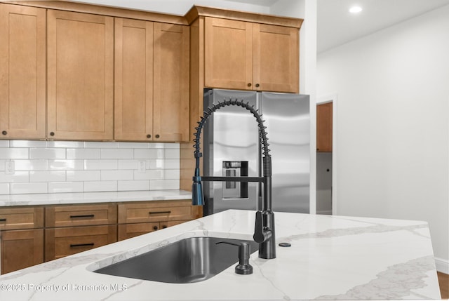 16043 Penn State Rd, Weeki Wachee, FL 34614 - kitchen featuring brown cabinets, tasteful backsplash, stainless steel fridge, and recessed lighting