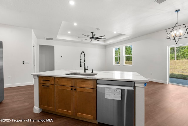 16043 Penn State Rd, Weeki Wachee, FL 34614 - kitchen featuring dishwasher, a sink, dark wood-style flooring, brown cabinets, and baseboards