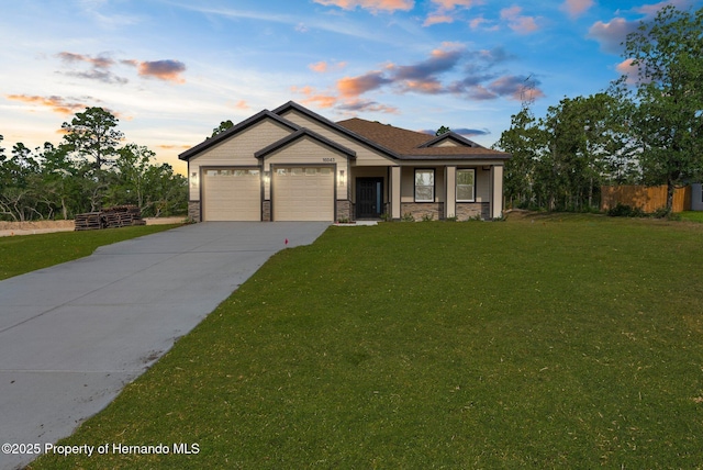 16043 Penn State Rd, Weeki Wachee, FL 34614 - craftsman-style house with concrete driveway, an attached garage, and stone siding