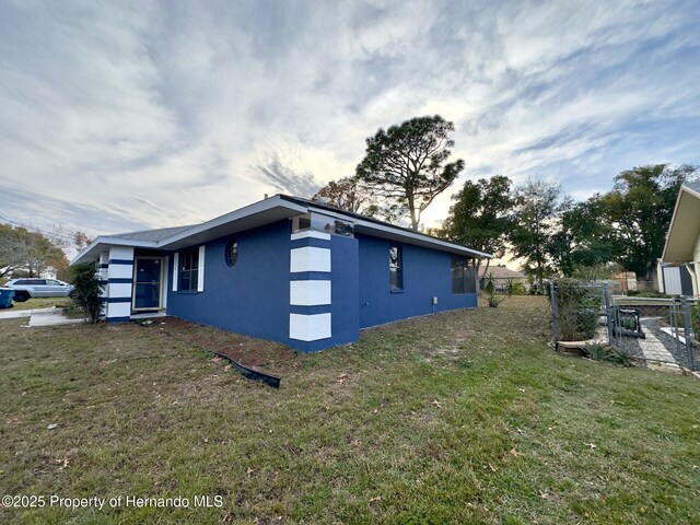 2253 Estill Ave, Spring Hill, FL 34609 - view of home's exterior featuring stucco siding