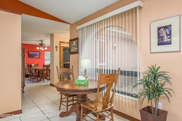 18216 Monteverde Dr, Shady Hills, FL 34610 - dining area with lofted ceiling, ceiling fan, and tile patterned flooring