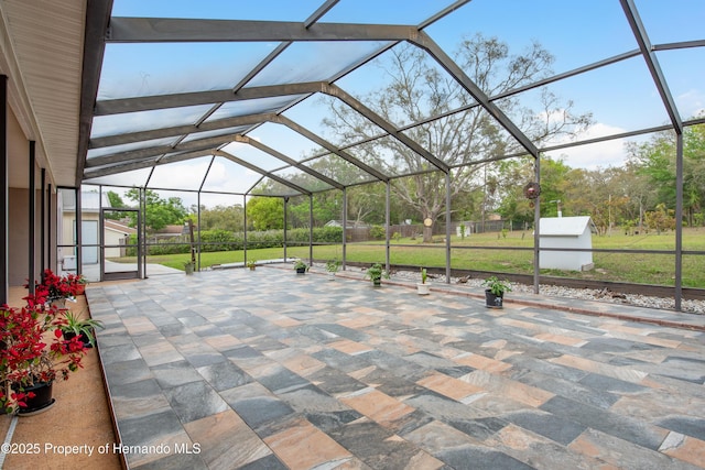18216 Monteverde Dr, Shady Hills, FL 34610 - view of patio / terrace with a lanai and fence