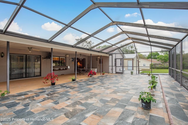18216 Monteverde Dr, Shady Hills, FL 34610 - unfurnished sunroom featuring a ceiling fan
