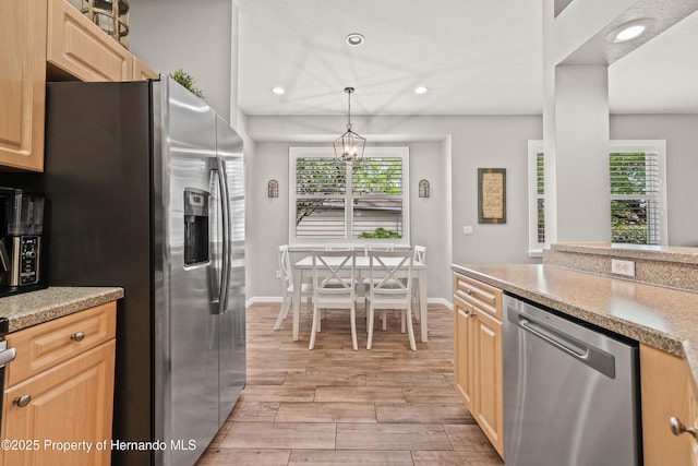 kitchen featuring light brown cabinetry, recessed lighting, light countertops, wood tiled floor, and stainless steel appliances