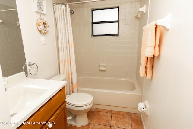 full bathroom featuring shower / bath combo, tile patterned flooring, vanity, and toilet
