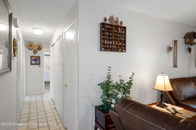 9414 Northcliffe Blvd, Spring Hill, FL 34606 - hall featuring a textured ceiling and light tile patterned flooring