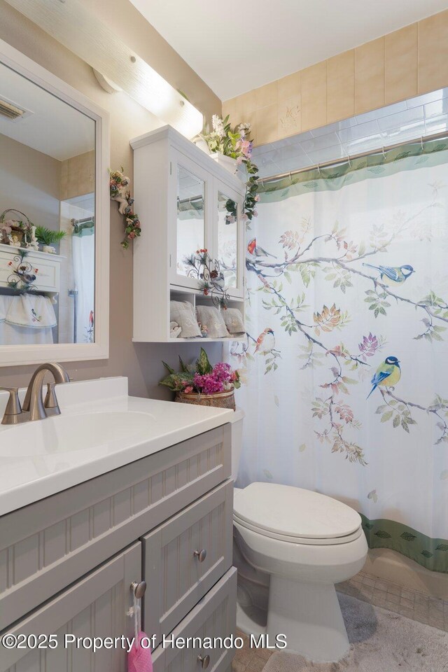 9414 Northcliffe Blvd, Spring Hill, FL 34606 - full bathroom featuring vanity, visible vents, and toilet