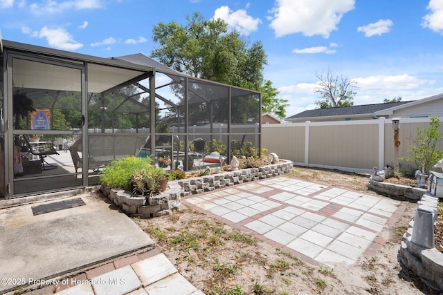 9414 Northcliffe Blvd, Spring Hill, FL 34606 - view of patio with glass enclosure and fence