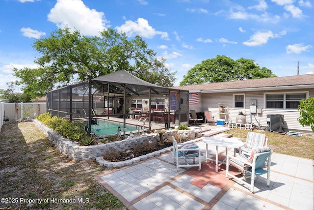 9414 Northcliffe Blvd, Spring Hill, FL 34606 - exterior space featuring a patio area, a fenced backyard, central air condition unit, an outdoor pool, and a lanai