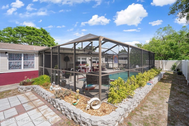 9414 Northcliffe Blvd, Spring Hill, FL 34606 - back of property with a patio area, a fenced backyard, glass enclosure, and a fenced in pool