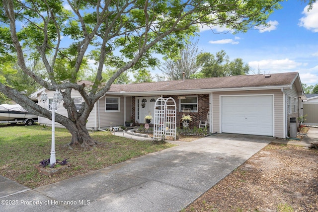 9414 Northcliffe Blvd, Spring Hill, FL 34606 - single story home featuring a garage, brick siding, a front lawn, and concrete driveway